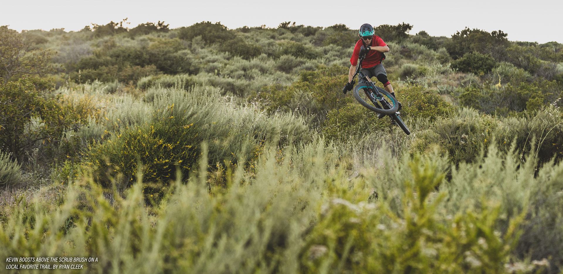 Kevin Aiello Interview: Kevin boosts above the scrub brush on a local favorite trail. by Ryan Cleek 